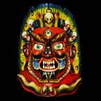 Colorful mask of Kal Bhairav with intricate designs on a black background