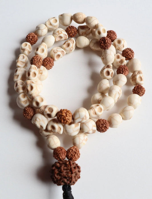 Handmade mala necklace with cream-colored skull beads and brown Rudraksha seeds