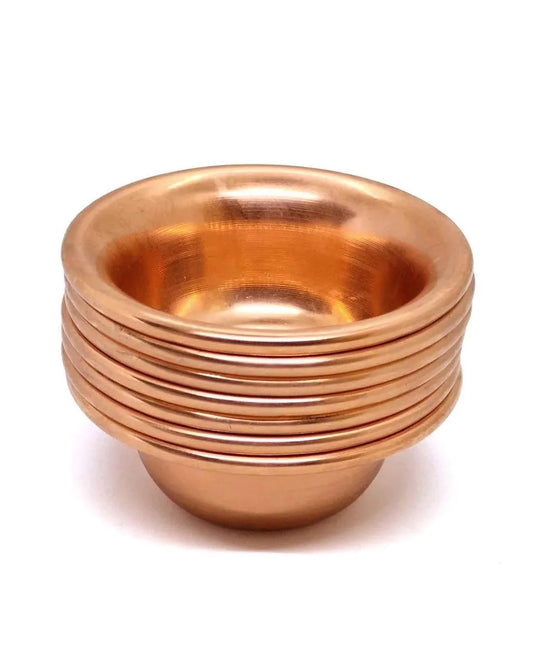 Stack of five polished copper ritual bowls