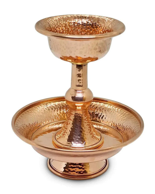 Hand-hammered copper ritual stand with a bowl and base tray