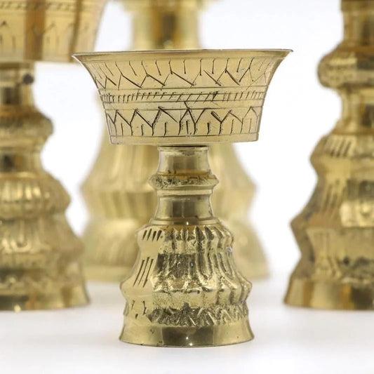 Handcrafted brass ceremonial cup with traditional engraved patterns
