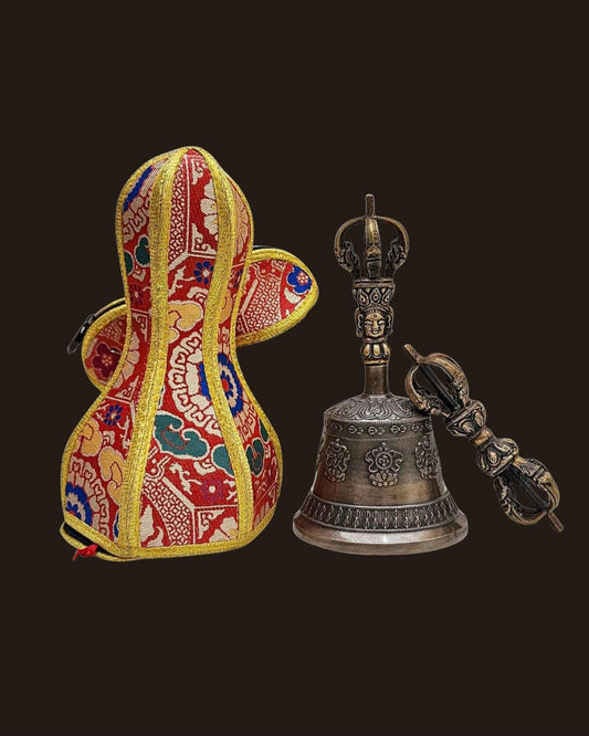 Tibetan Buddhist ritual bell (Ghanta) with a traditional decorative fabric case